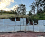 Large engineered retaining wall built with heavy duty posts