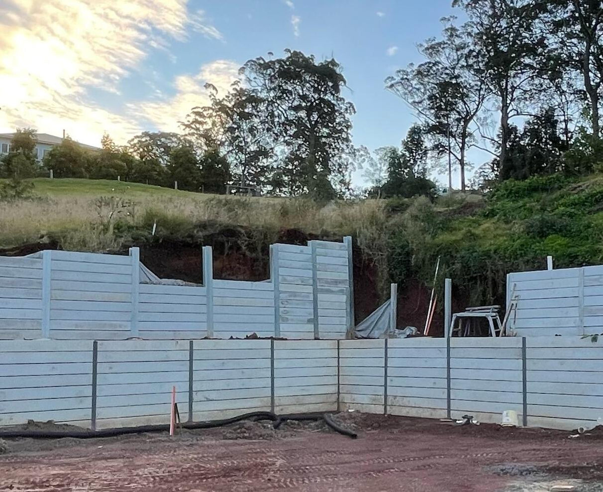 Large engineered retaining wall built with heavy duty posts