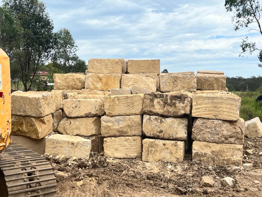 B grade sandstone blocks 500 x 500mm stacked in the yard